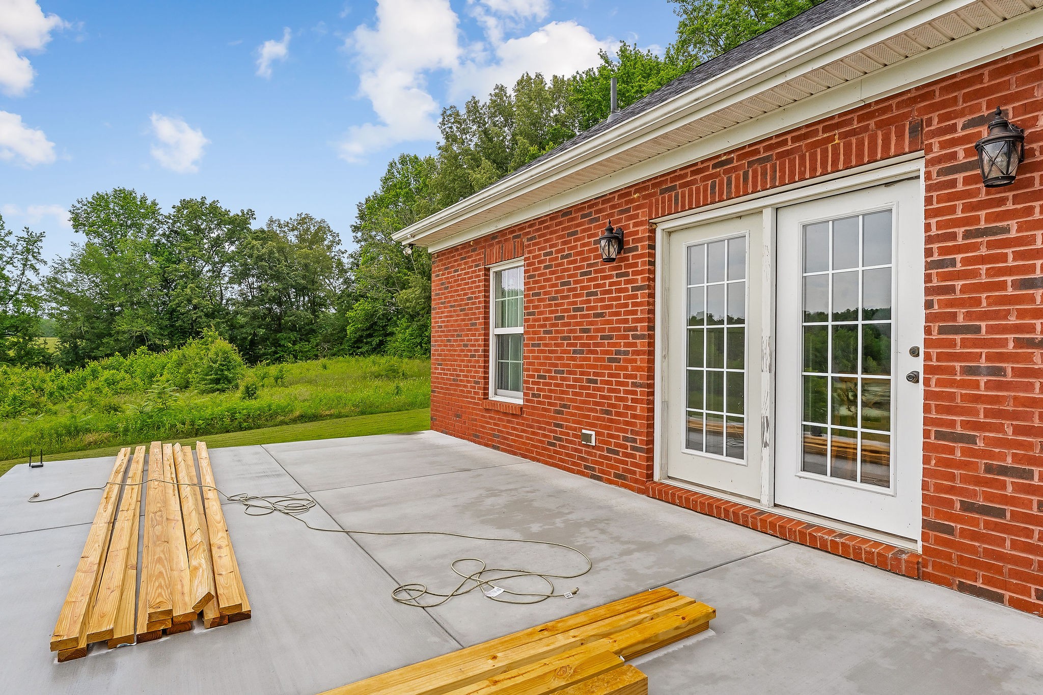 656 Osement Road McMinnville, TN 37110 - Photo 40 of 43 a backyard with a garden and entertaining space