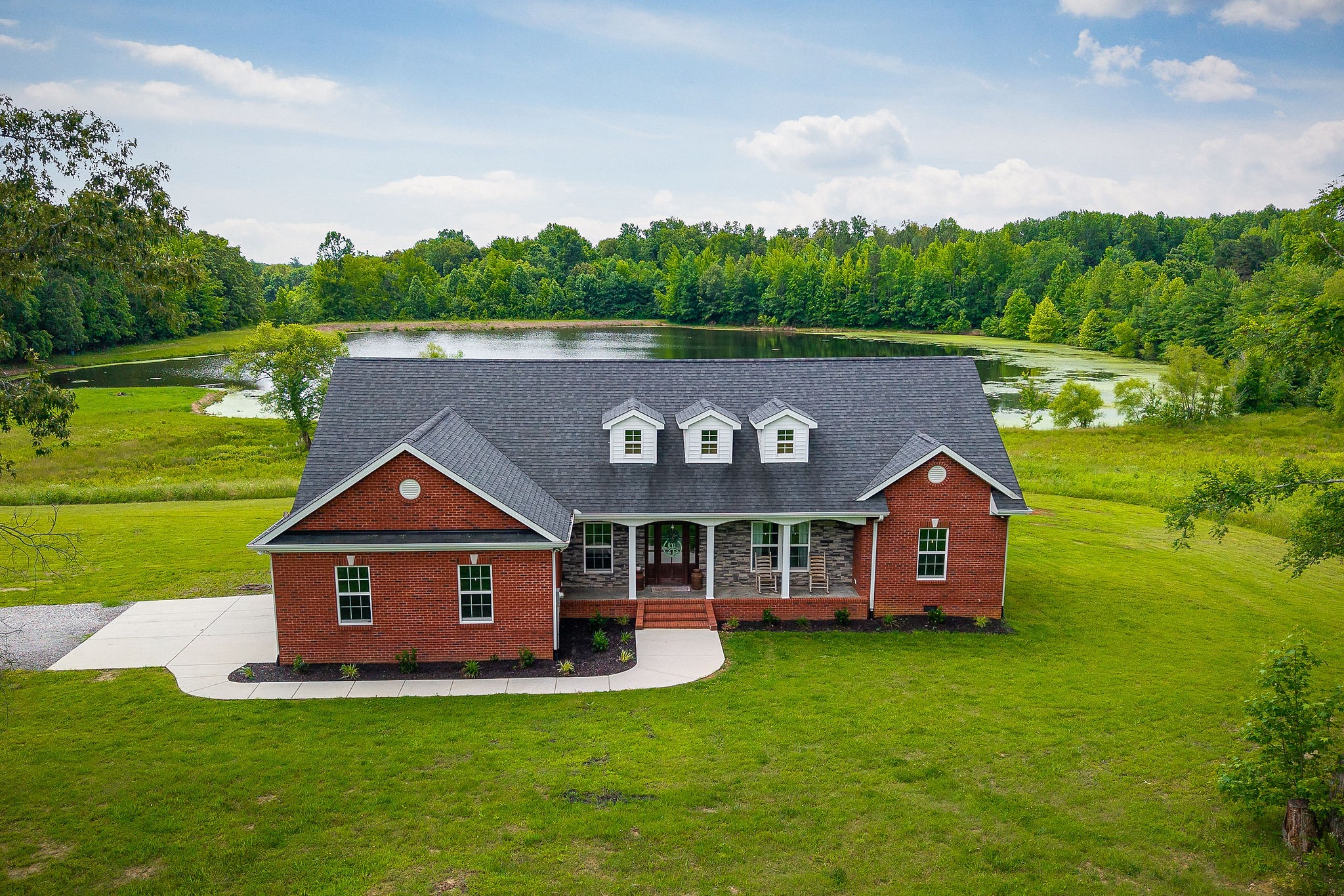 656 Osement Road McMinnville, TN 37110 - Photo 4 of 43 a front view of a house with garden