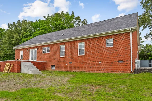a backyard of a house with lots of green space