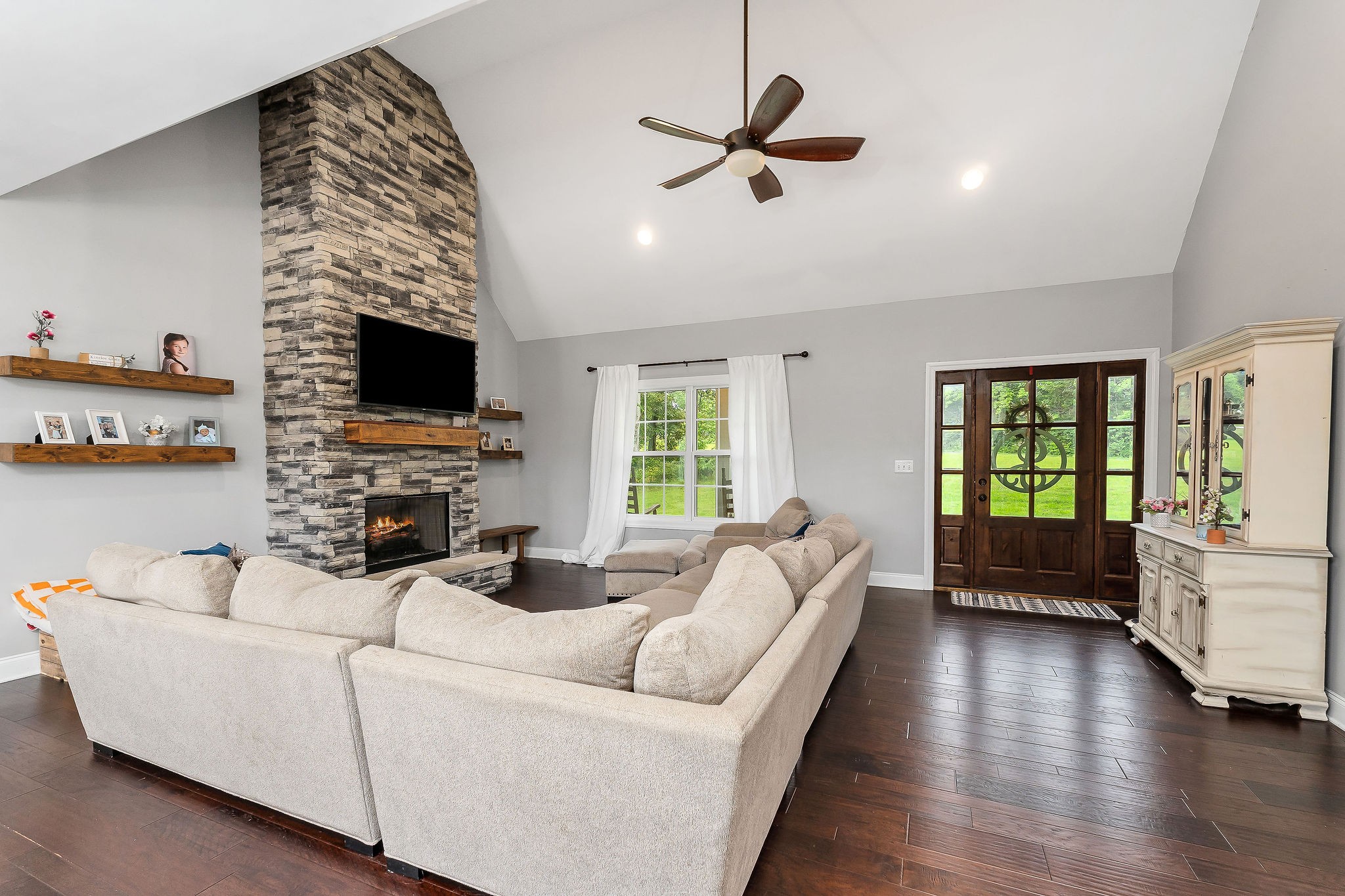 656 Osement Road McMinnville, TN 37110 - Photo 9 of 43 a living room with furniture and a flat screen tv