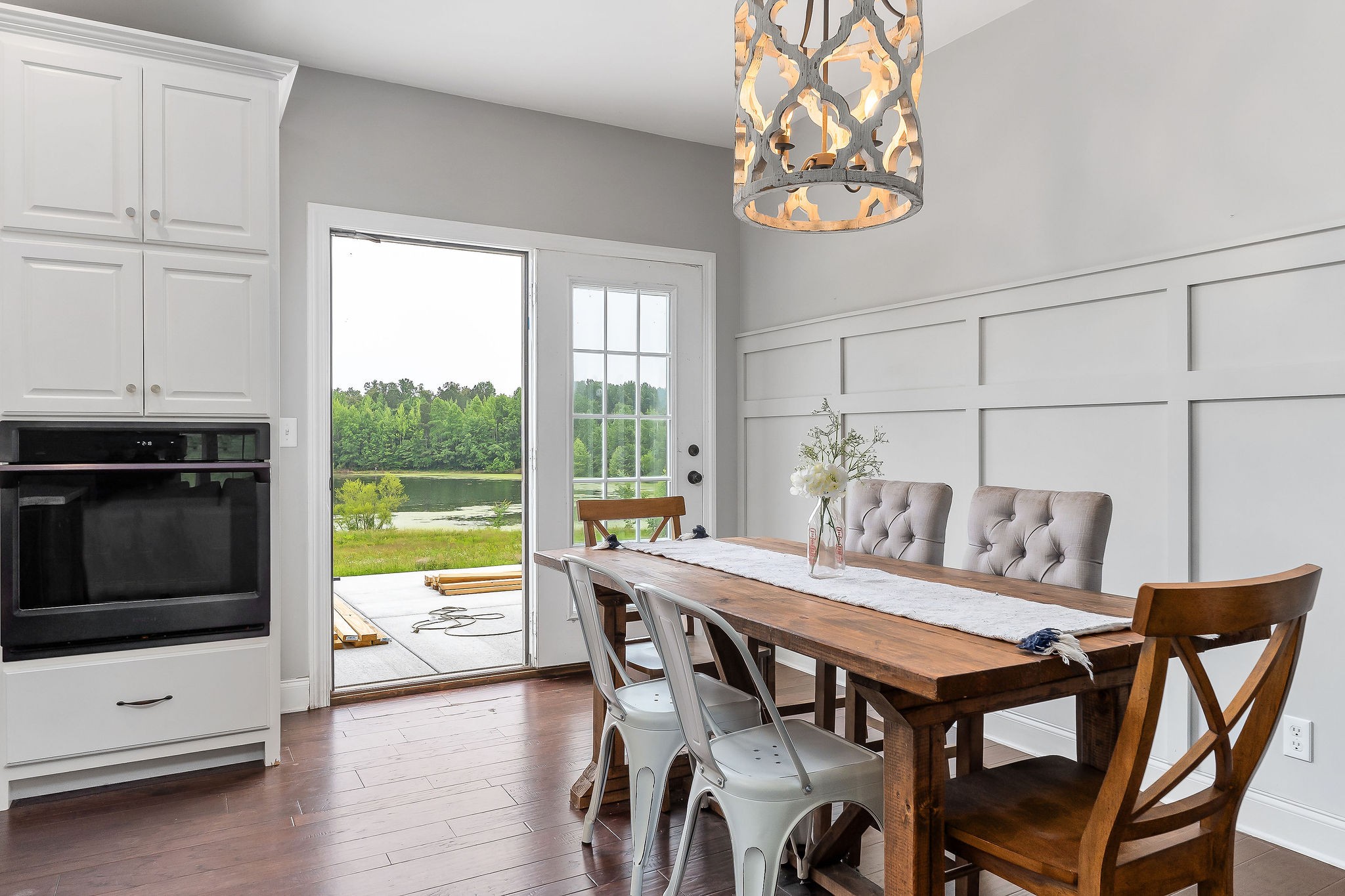 656 Osement Road McMinnville, TN 37110 - Photo 10 of 43 a view of a dining room with furniture a chandelier and wooden floor