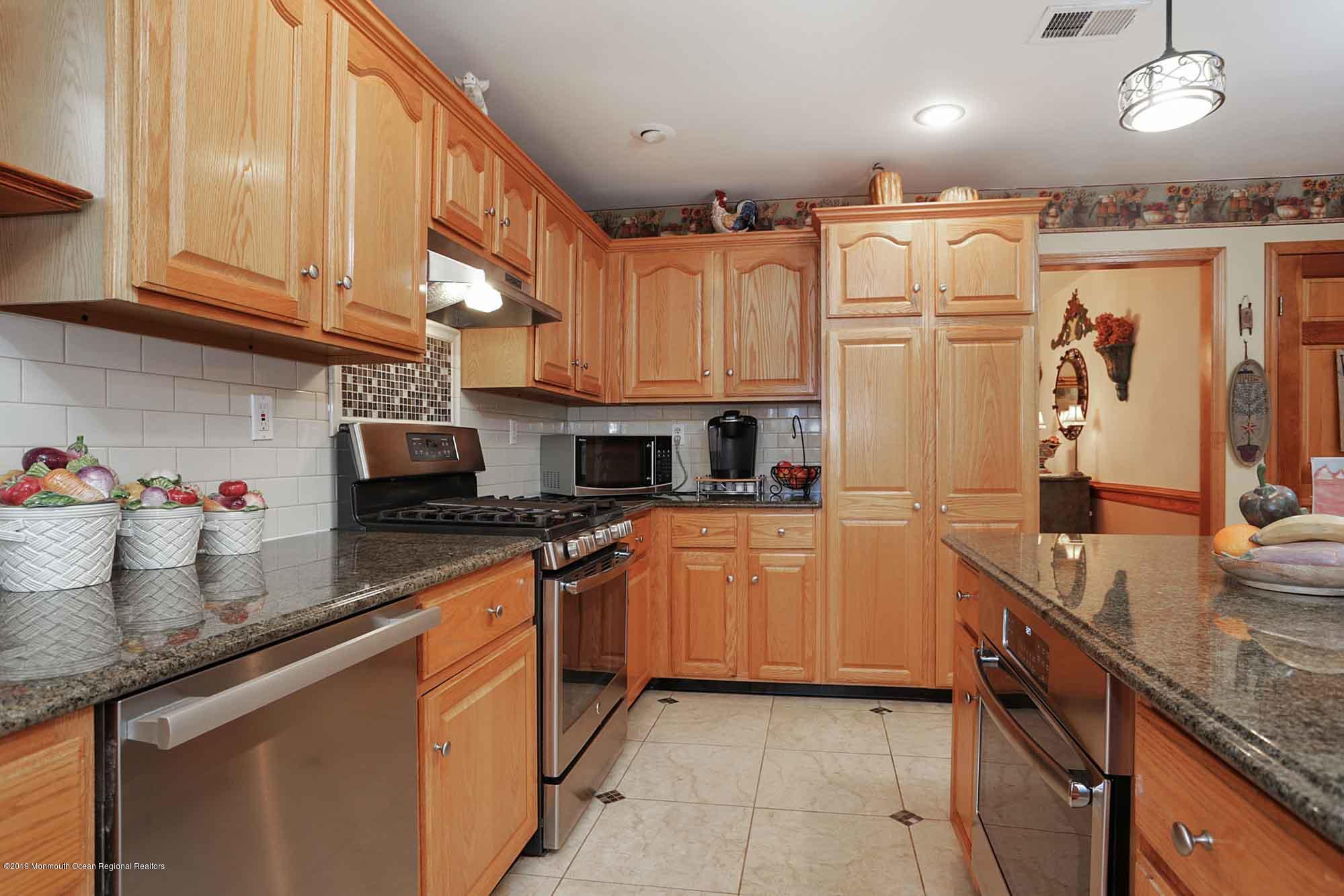 40 Ave Of Two Rivers Rumson, NJ 07760 - Photo 14 of 41 a kitchen with stainless steel appliances granite countertop a refrigerator and a sink