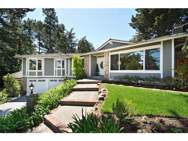 255 Darrell Road Hillsborough, CA 94010 - Photo 1 of 25 a front view of a house with a yard