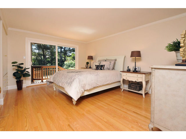 255 Darrell Road Hillsborough, CA 94010 - Photo 11 of 25 a bedroom with a bed and a large window