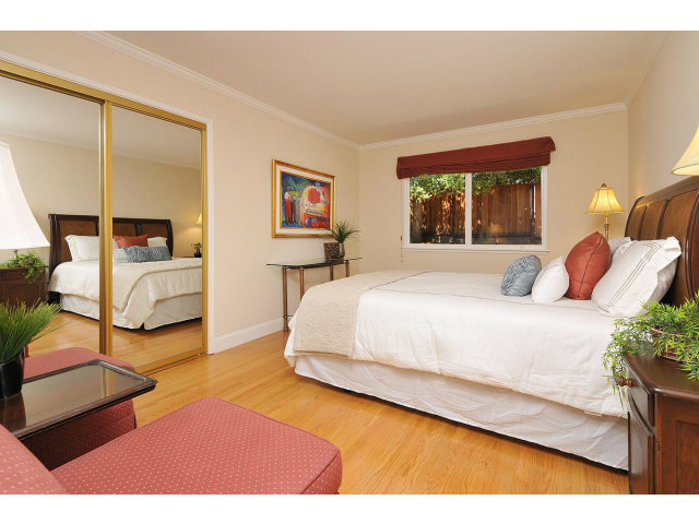 255 Darrell Road Hillsborough, CA 94010 - Photo 15 of 25 a spacious bedroom with a bed and window