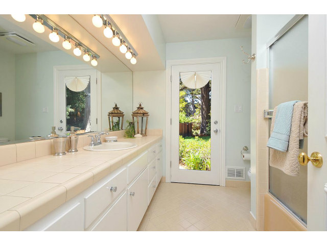 255 Darrell Road Hillsborough, CA 94010 - Photo 16 of 25 a bathroom with a double vanity sink and a mirror