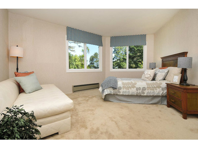 255 Darrell Road Hillsborough, CA 94010 - Photo 17 of 25 a bedroom with a bed and a couch