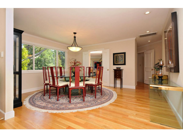 255 Darrell Road Hillsborough, CA 94010 - Photo 6 of 25 a view of a dining room with furniture window and wooden floor