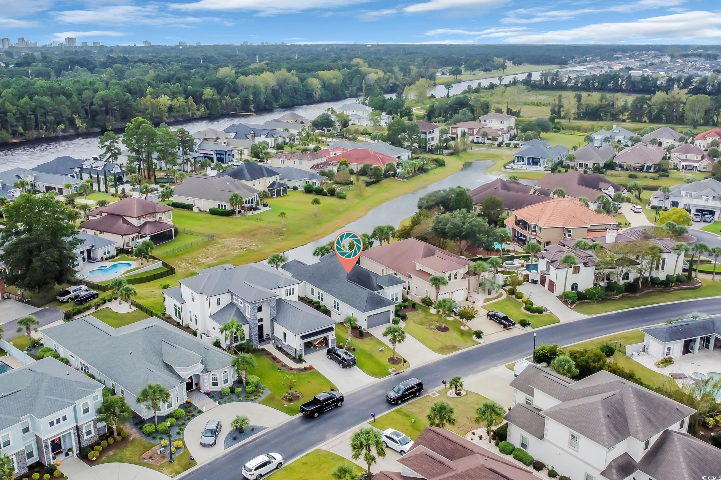 937 Bluffview Drive Myrtle Beach, SC 29579 - Photo 11 of 40 Aerial view of residential area featuring a large body of water