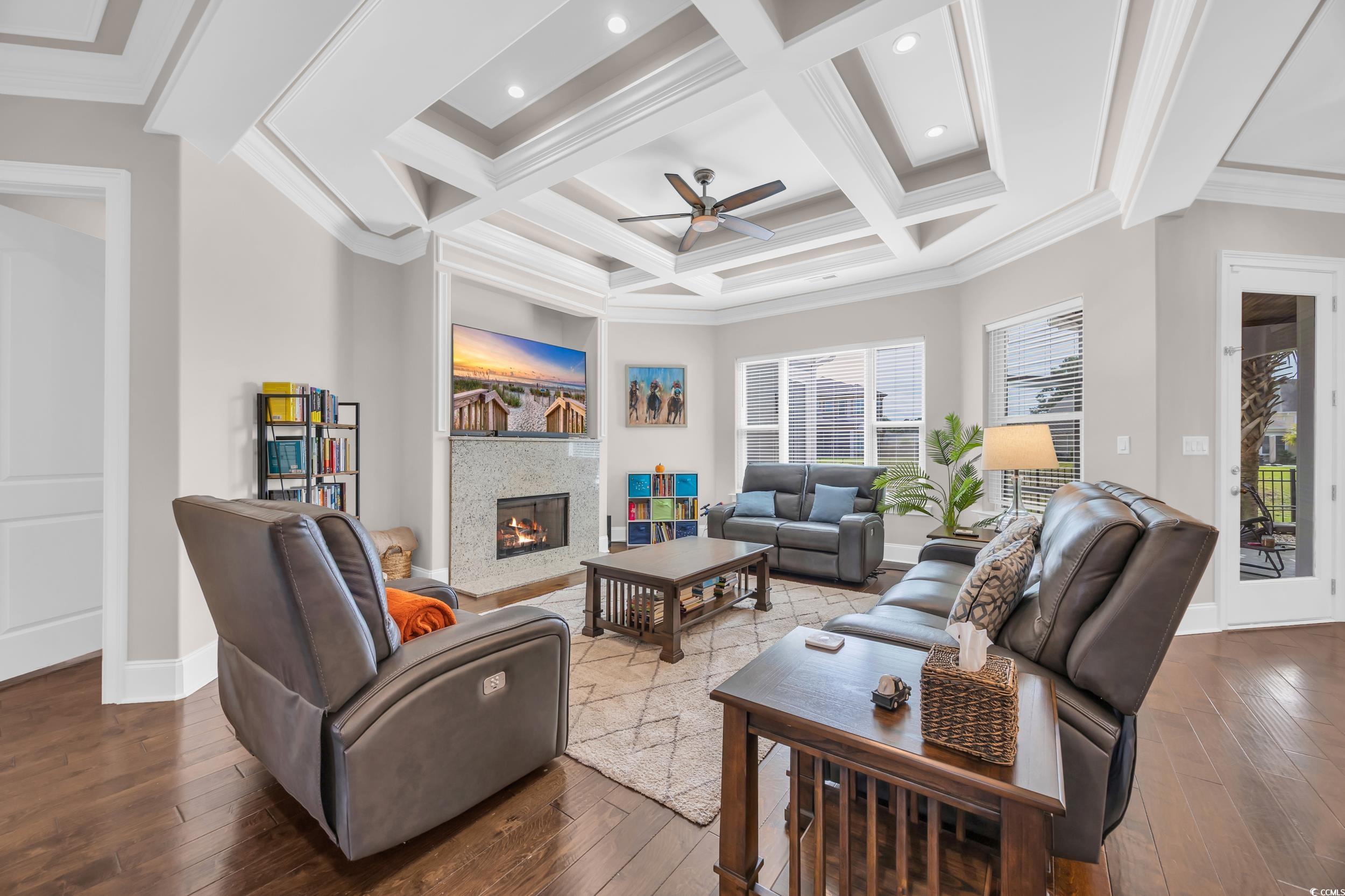 937 Bluffview Drive Myrtle Beach, SC 29579 - Photo 17 of 40 Living room featuring coffered ceiling, beam ceiling, ornamental molding, a ceiling fan, and hardwood / wood-style floors