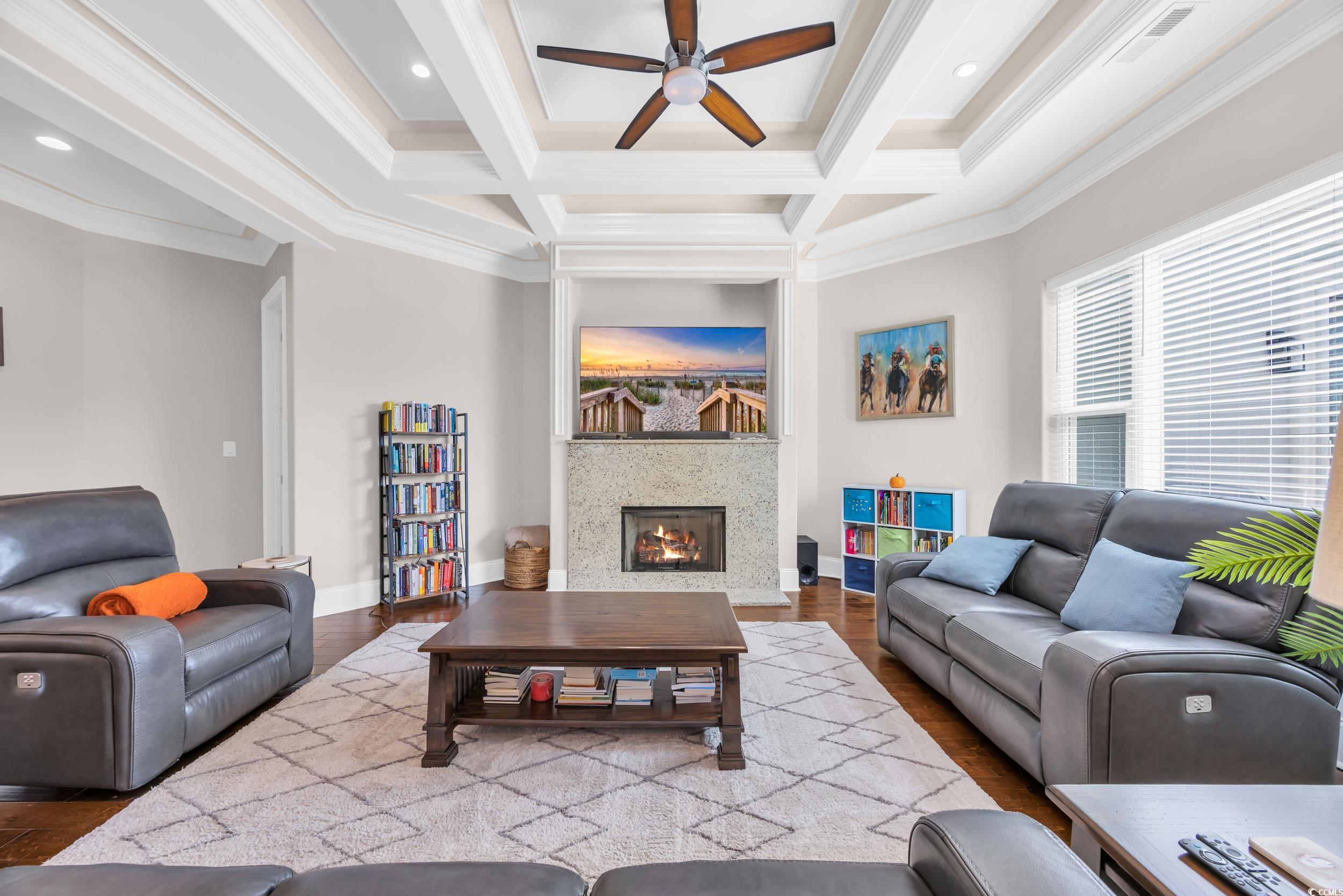937 Bluffview Drive Myrtle Beach, SC 29579 - Photo 20 of 40 Living area with beamed ceiling, ceiling fan, coffered ceiling, crown molding, and wood finished floors