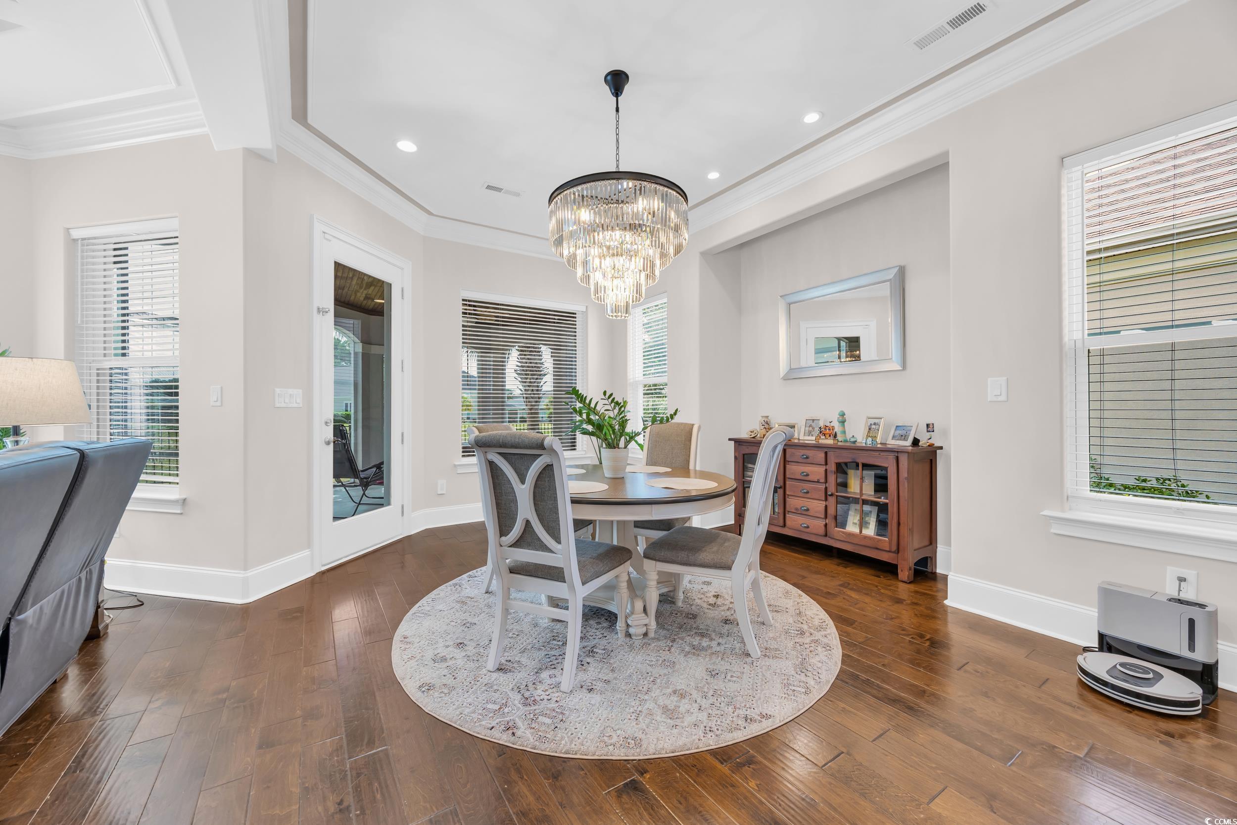 937 Bluffview Drive Myrtle Beach, SC 29579 - Photo 21 of 40 Dining area featuring plenty of natural light, crown molding, dark wood finished floors, a chandelier, and recessed lighting