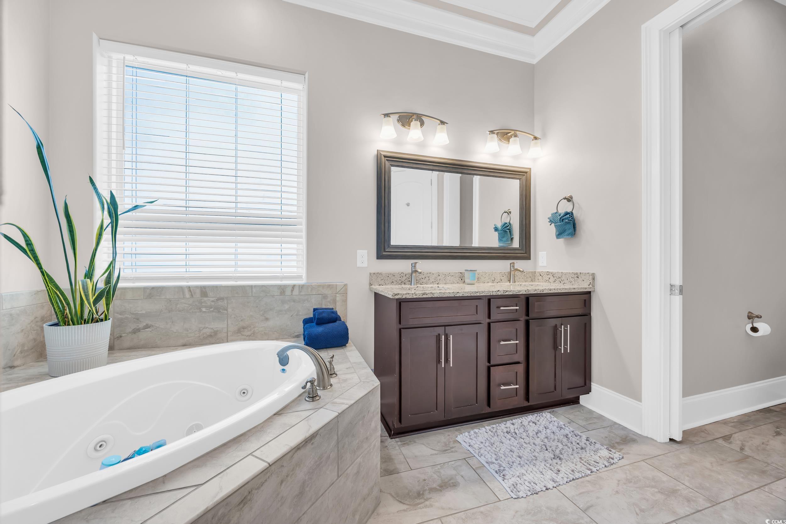 937 Bluffview Drive Myrtle Beach, SC 29579 - Photo 23 of 40 Full bath featuring double vanity, ornamental molding, and a whirlpool tub