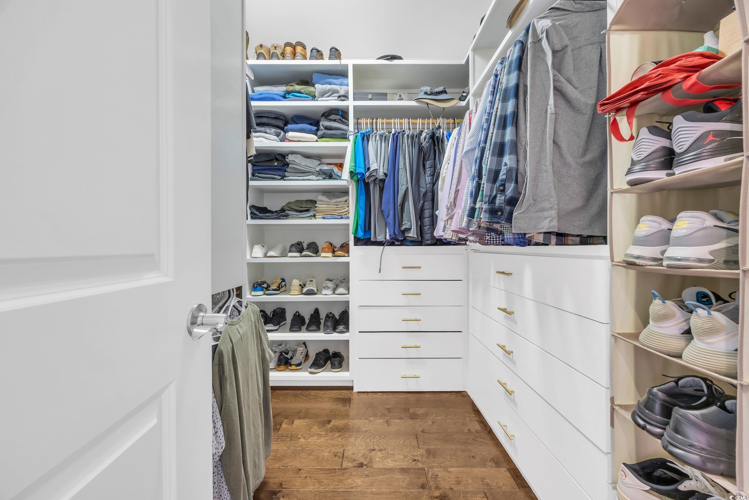 937 Bluffview Drive Myrtle Beach, SC 29579 - Photo 24 of 40 Walk in closet with dark wood-type flooring
