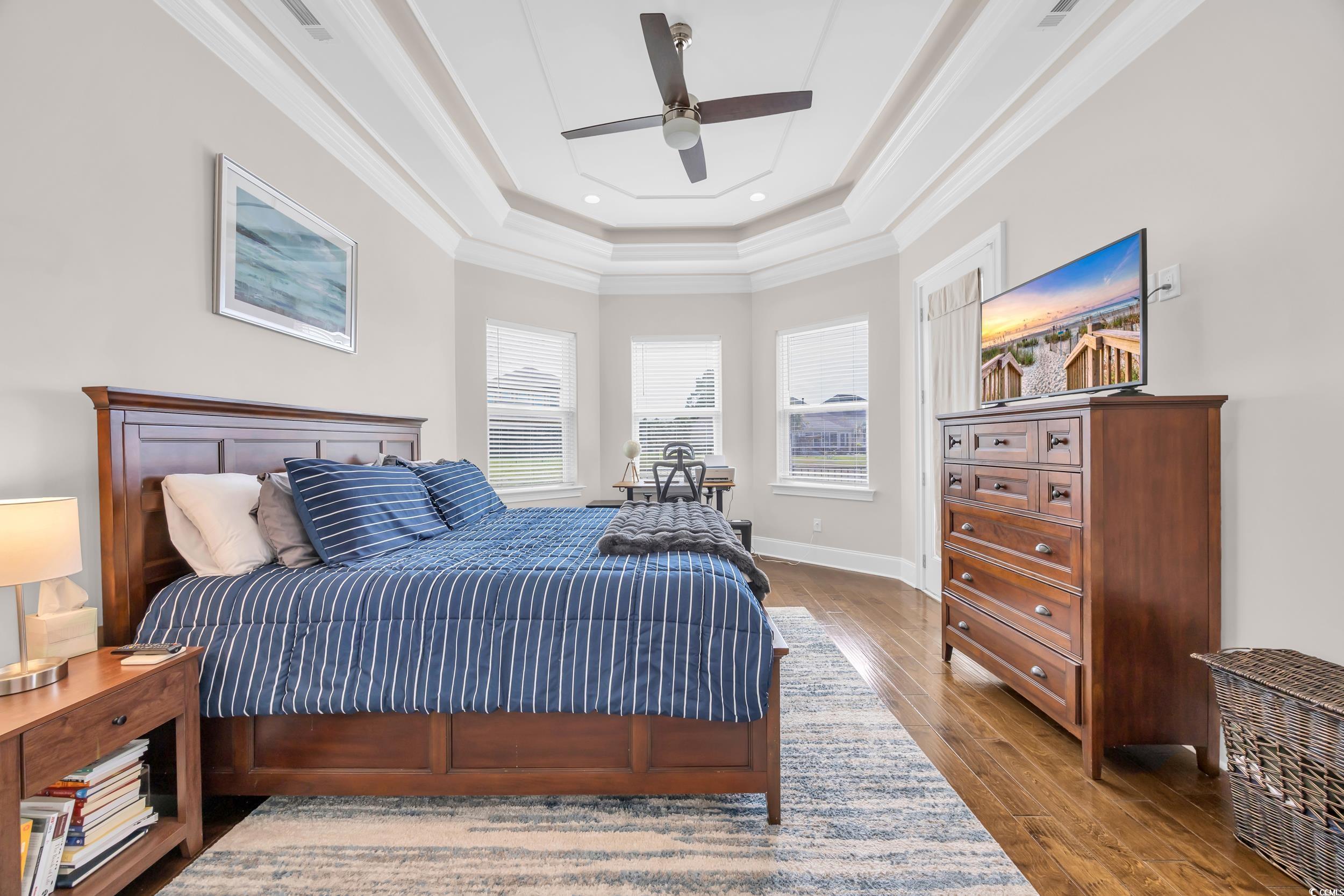 937 Bluffview Drive Myrtle Beach, SC 29579 - Photo 27 of 40 Bedroom featuring crown molding, a tray ceiling, dark wood-type flooring, ceiling fan, and recessed lighting