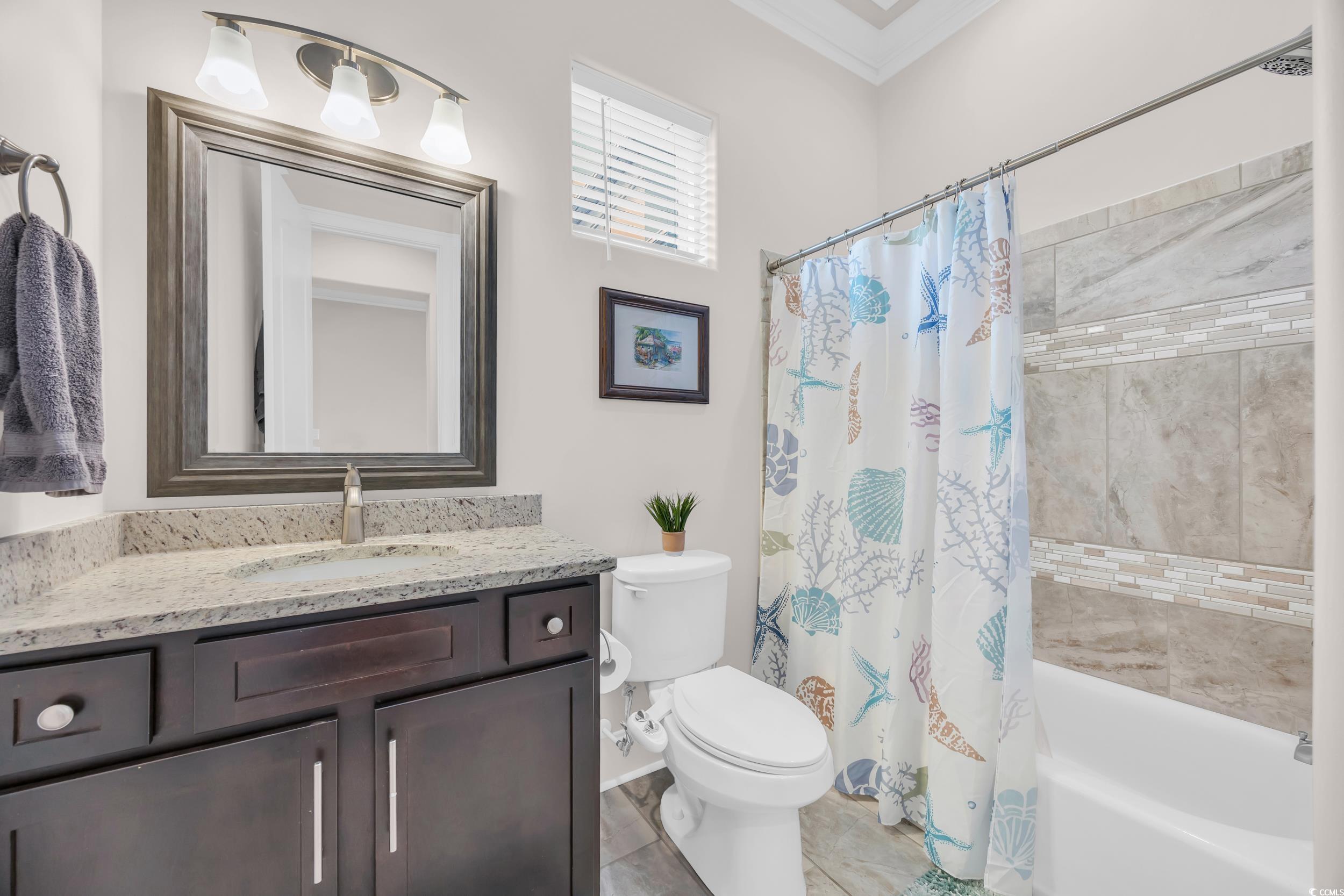 937 Bluffview Drive Myrtle Beach, SC 29579 - Photo 28 of 40 Bathroom with shower / tub combo, vanity, and crown molding