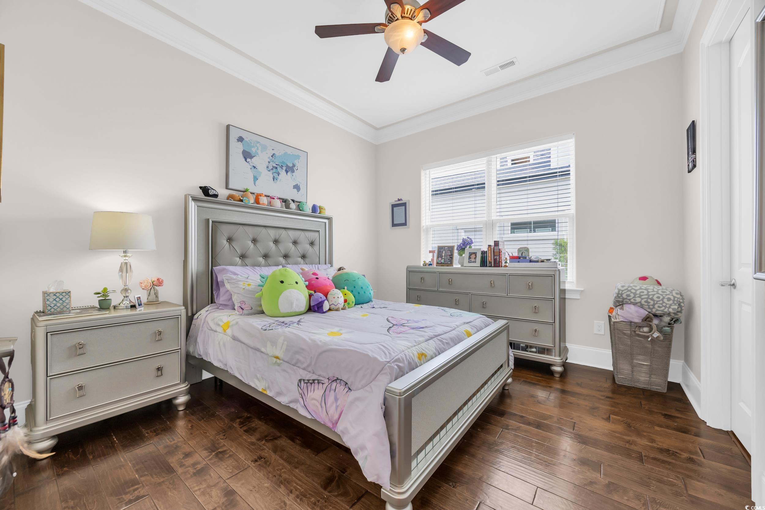 937 Bluffview Drive Myrtle Beach, SC 29579 - Photo 30 of 40 Bedroom with crown molding, dark wood finished floors, and a ceiling fan