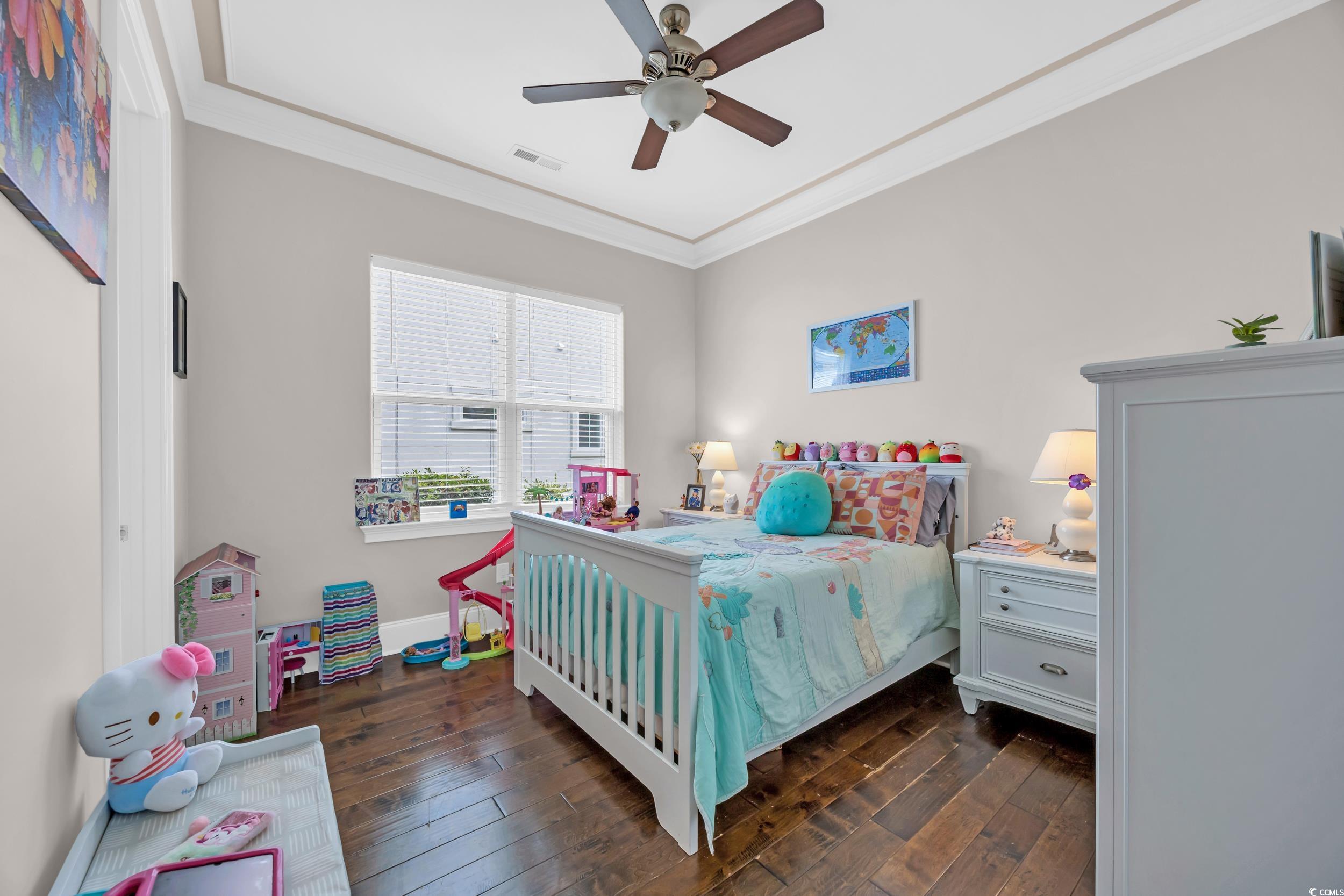 937 Bluffview Drive Myrtle Beach, SC 29579 - Photo 33 of 40 Bedroom with ornamental molding, dark wood-style floors, and a ceiling fan