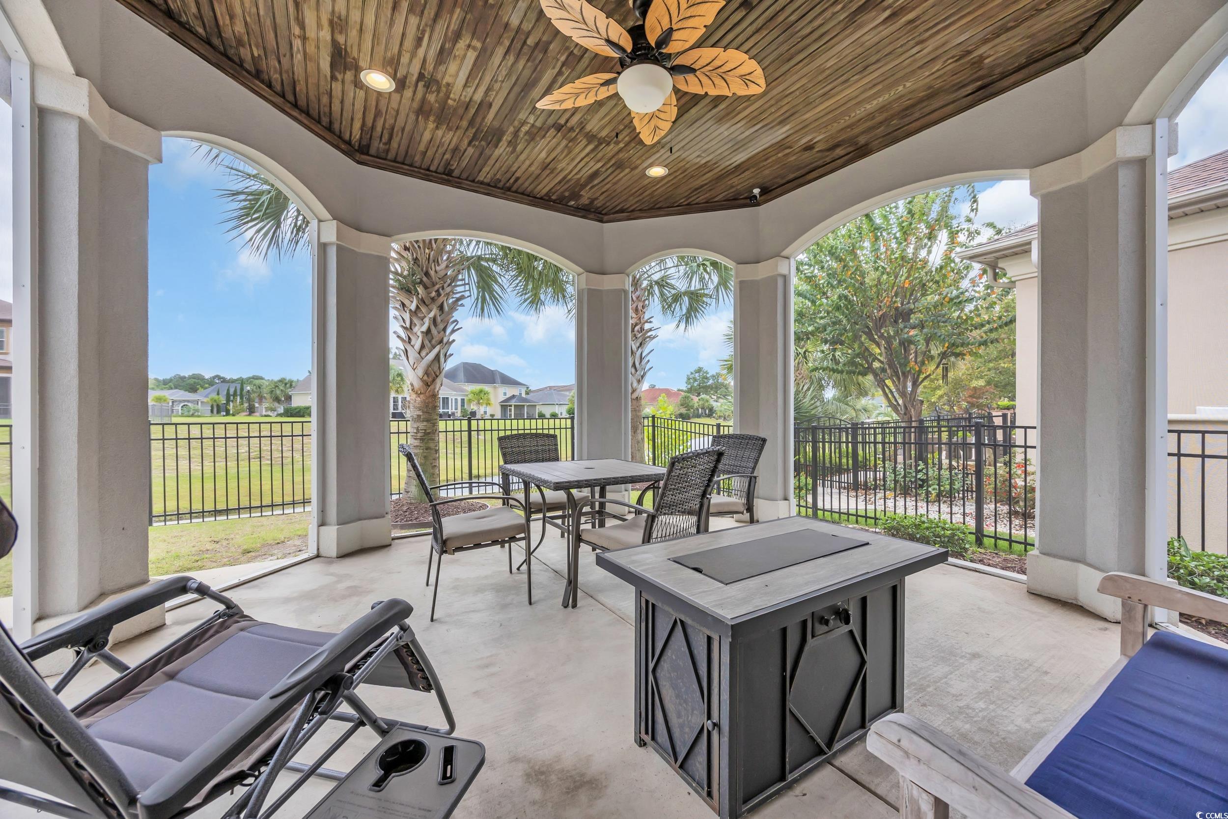 937 Bluffview Drive Myrtle Beach, SC 29579 - Photo 5 of 40 View of patio / terrace featuring a residential view, outdoor dining space, and ceiling fan