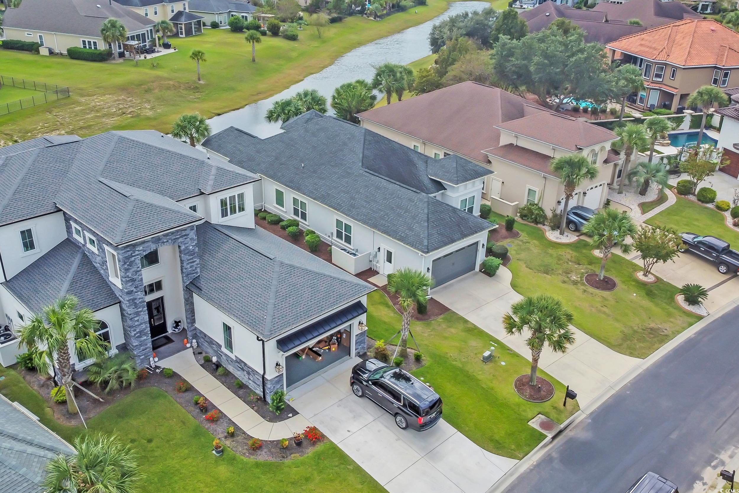 937 Bluffview Drive Myrtle Beach, SC 29579 - Photo 7 of 40 Aerial perspective of suburban area featuring a large body of water