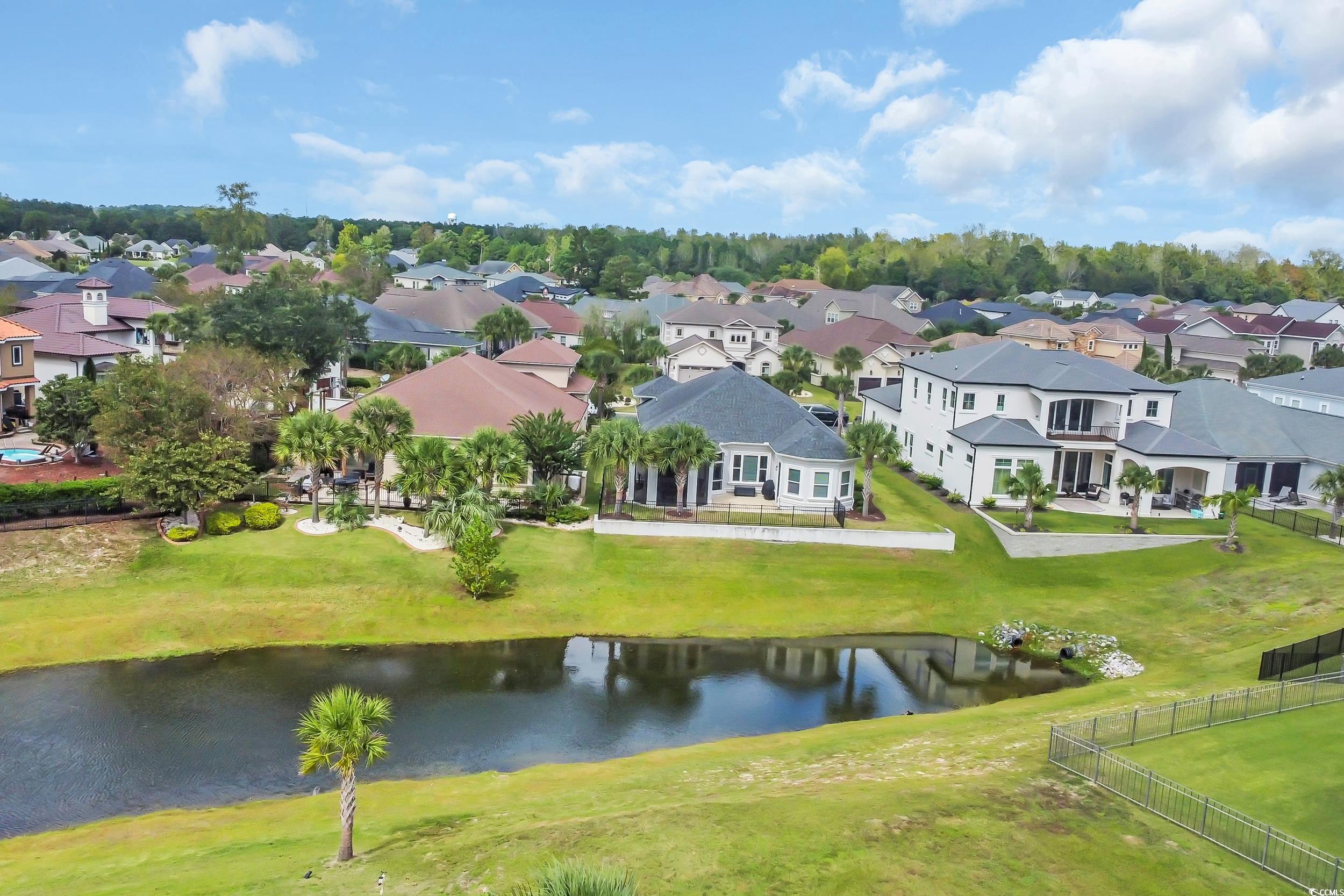 937 Bluffview Drive Myrtle Beach, SC 29579 - Photo 9 of 40 Aerial perspective of suburban area with a large body of water