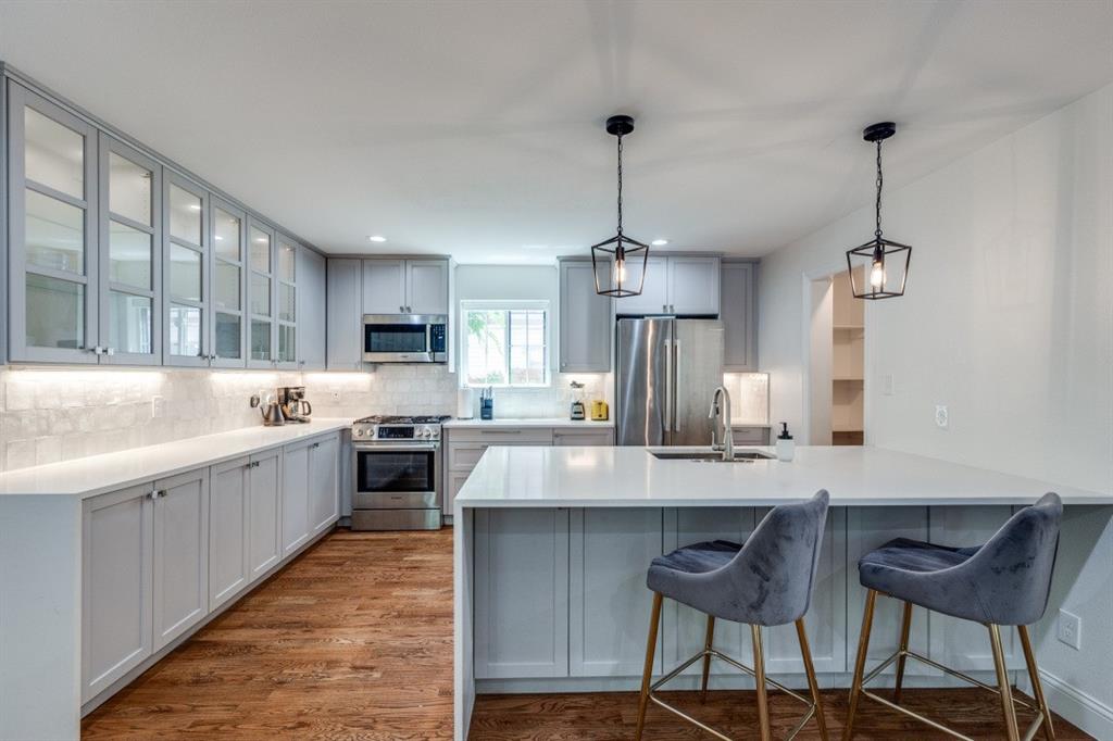 1000 Cameron Avenue Dallas, TX 75223 - Photo 13 of 38 a large kitchen with kitchen island a island in the center