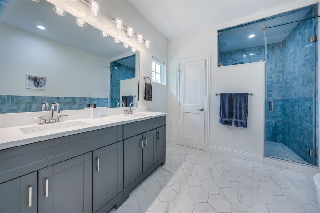 1000 Cameron Avenue Dallas, TX 75223 - Photo 20 of 38 a spacious bathroom with a double vanity sink mirror and shower