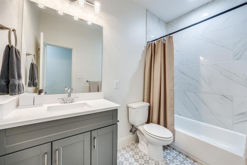 1000 Cameron Avenue Dallas, TX 75223 - Photo 25 of 38 a bathroom with a sink toilet and shower