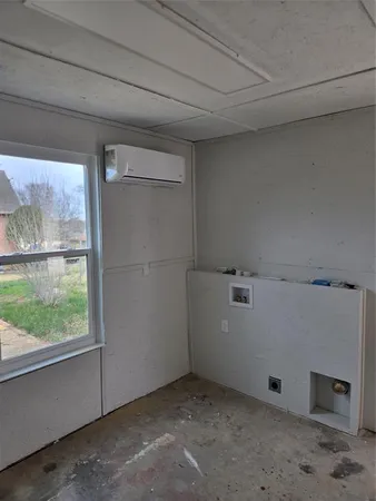 a view of storage and utility room with washer and dryer