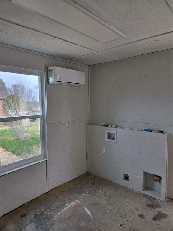 404 South Pecan Street Bells, TX 75414 - Photo 14 of 20 a view of storage and utility room with washer and dryer