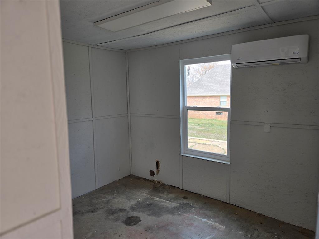 404 South Pecan Street Bells, TX 75414 - Photo 15 of 20 a view of a window in an empty room