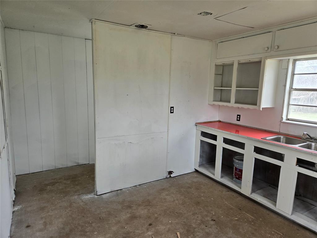 404 South Pecan Street Bells, TX 75414 - Photo 17 of 20 a view of a livingroom with an empty space and a window