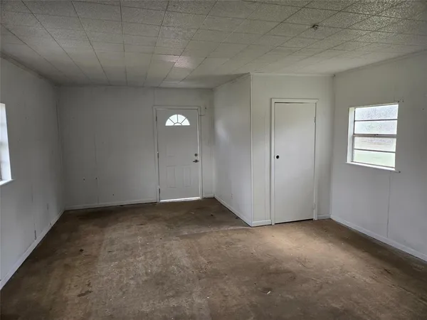 an empty room with windows