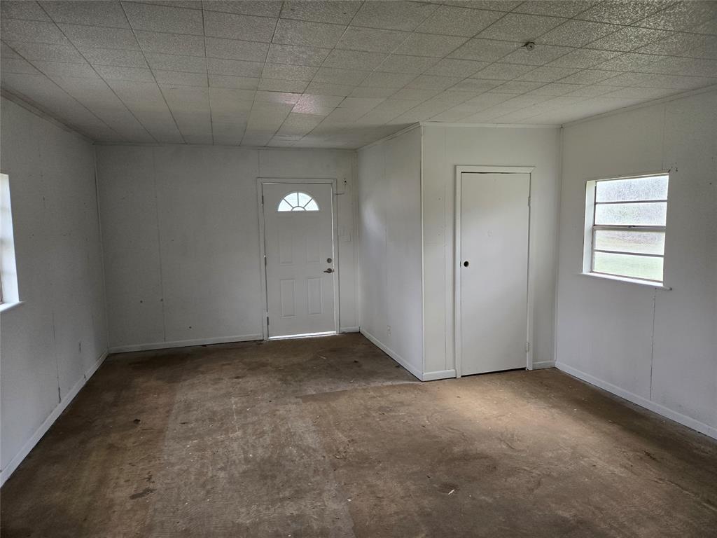 404 South Pecan Street Bells, TX 75414 - Photo 19 of 20 an empty room with windows