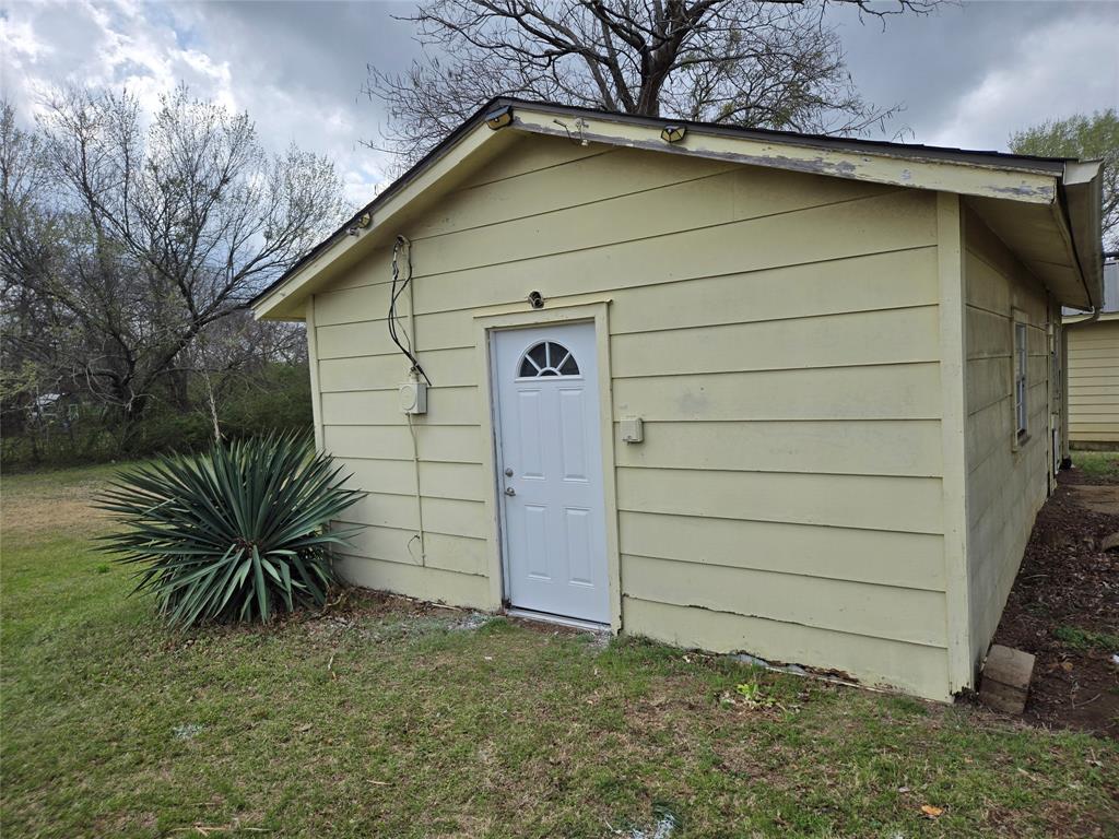 404 South Pecan Street Bells, TX 75414 - Photo 20 of 20 a view of a garage