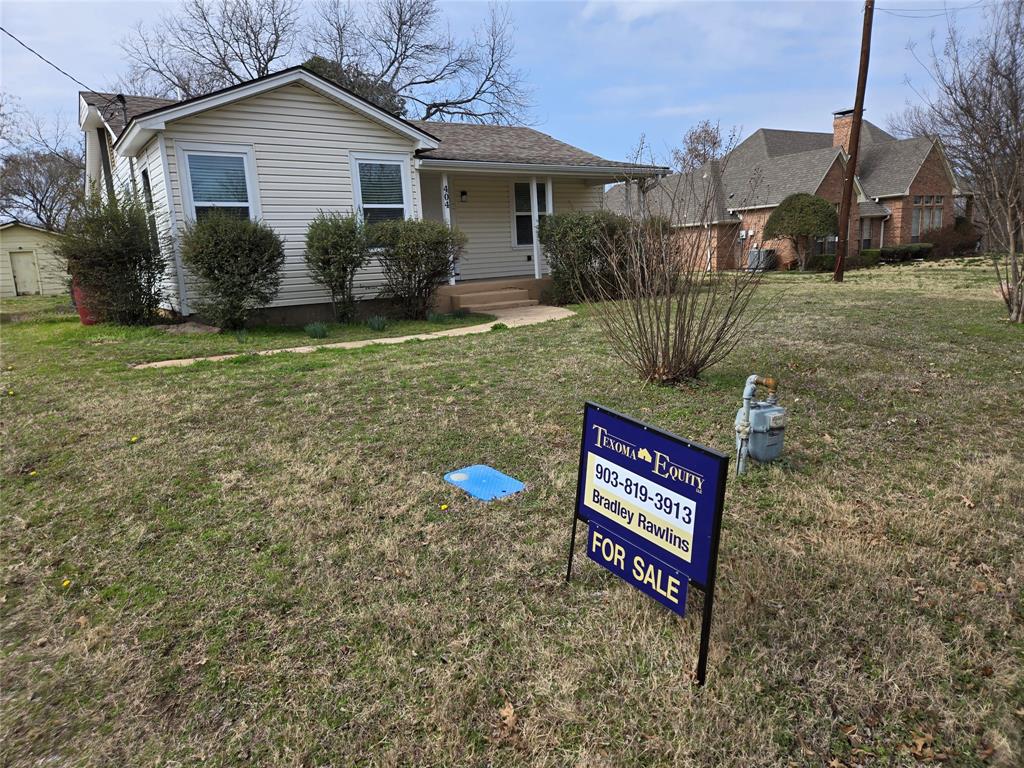 404 South Pecan Street Bells, TX 75414 - Photo 2 of 20 a view of a house with a yard