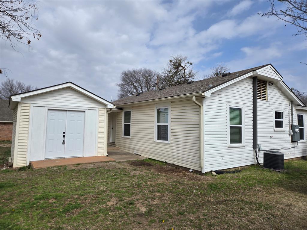 404 South Pecan Street Bells, TX 75414 - Photo 3 of 20 a view of a house with a backyard