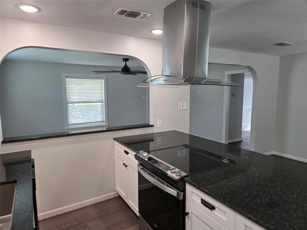 404 South Pecan Street Bells, TX 75414 - Photo 9 of 20 a kitchen with granite countertop a stove and a sink