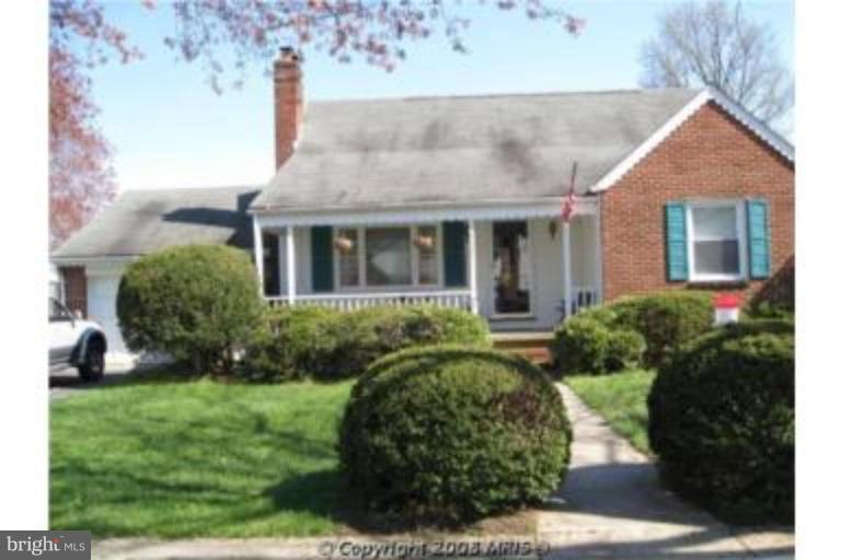 9117 Smith Avenue Nottingham, MD 21236 - Photo 1 of 17 a front view of a house with a yard