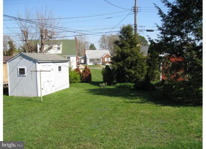 9117 Smith Avenue Nottingham, MD 21236 - Photo 14 of 17 a view of a house with a back yard