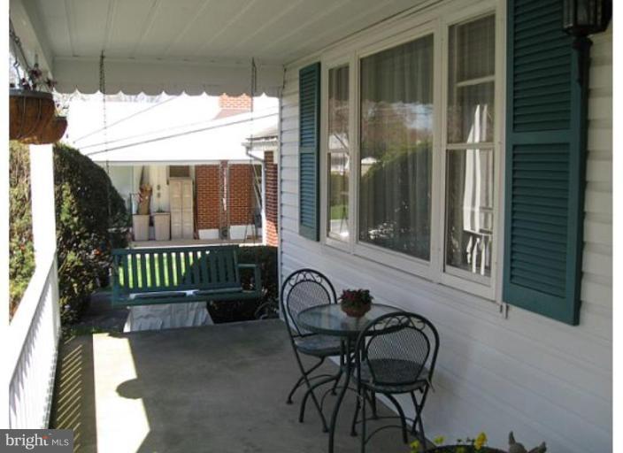 9117 Smith Avenue Nottingham, MD 21236 - Photo 16 of 17 a view of a chairs and table in the patio
