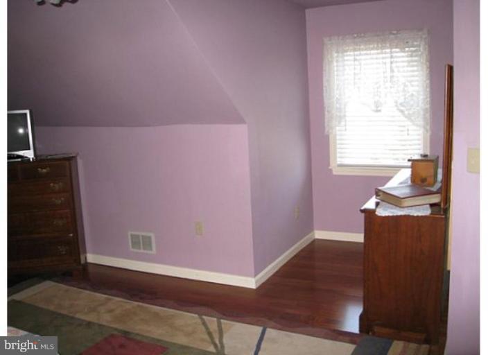 9117 Smith Avenue Nottingham, MD 21236 - Photo 5 of 17 a view of a livingroom with wooden floor and a window