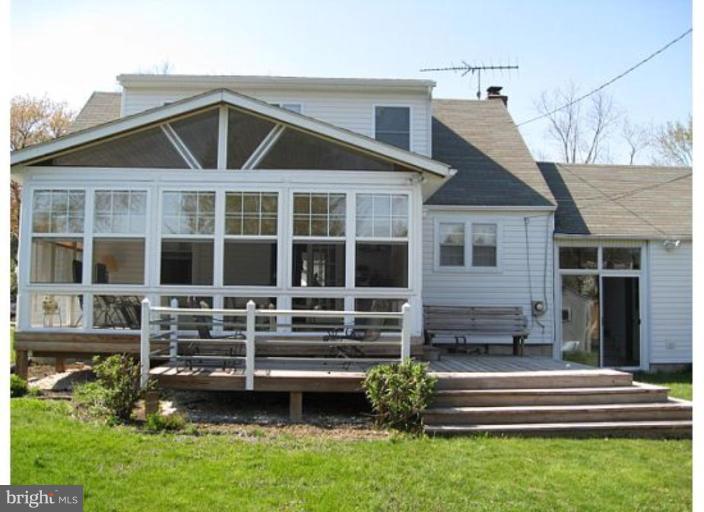 9117 Smith Avenue Nottingham, MD 21236 - Photo 9 of 17 a front view of a house with a yard