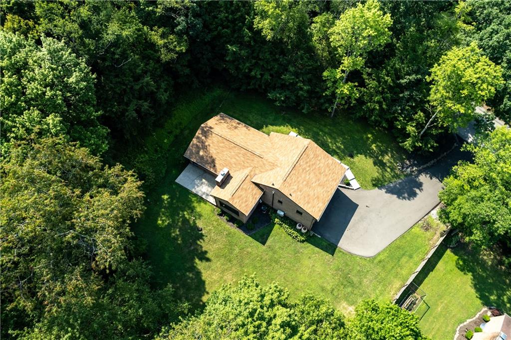 111 West Cruikshank Road Butler, PA 16002 - Photo 46 of 47 an aerial view of a house with a yard and lake view