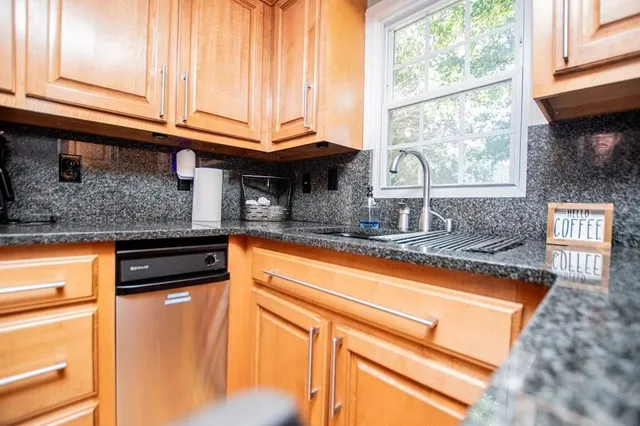 a view of a room with furniture window and wooden floor