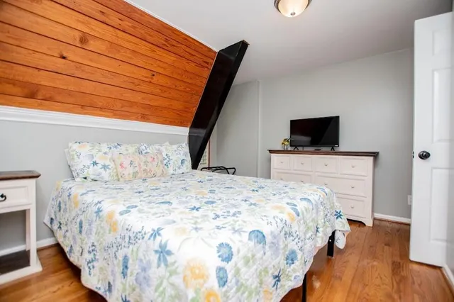 a view of balcony with wooden floor and fence