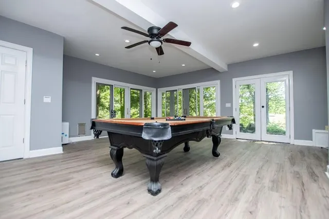 a view of a lush green forest with lots of trees