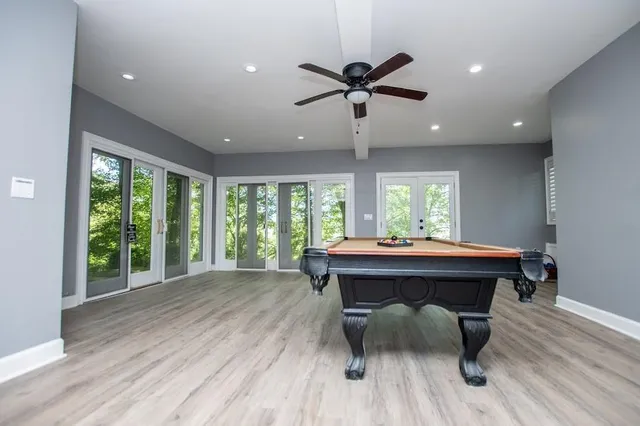 a view of a swimming pool and an outdoor seating