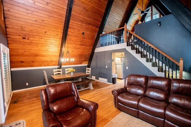 a kitchen with stainless steel appliances granite countertop a stove microwave and refrigerator