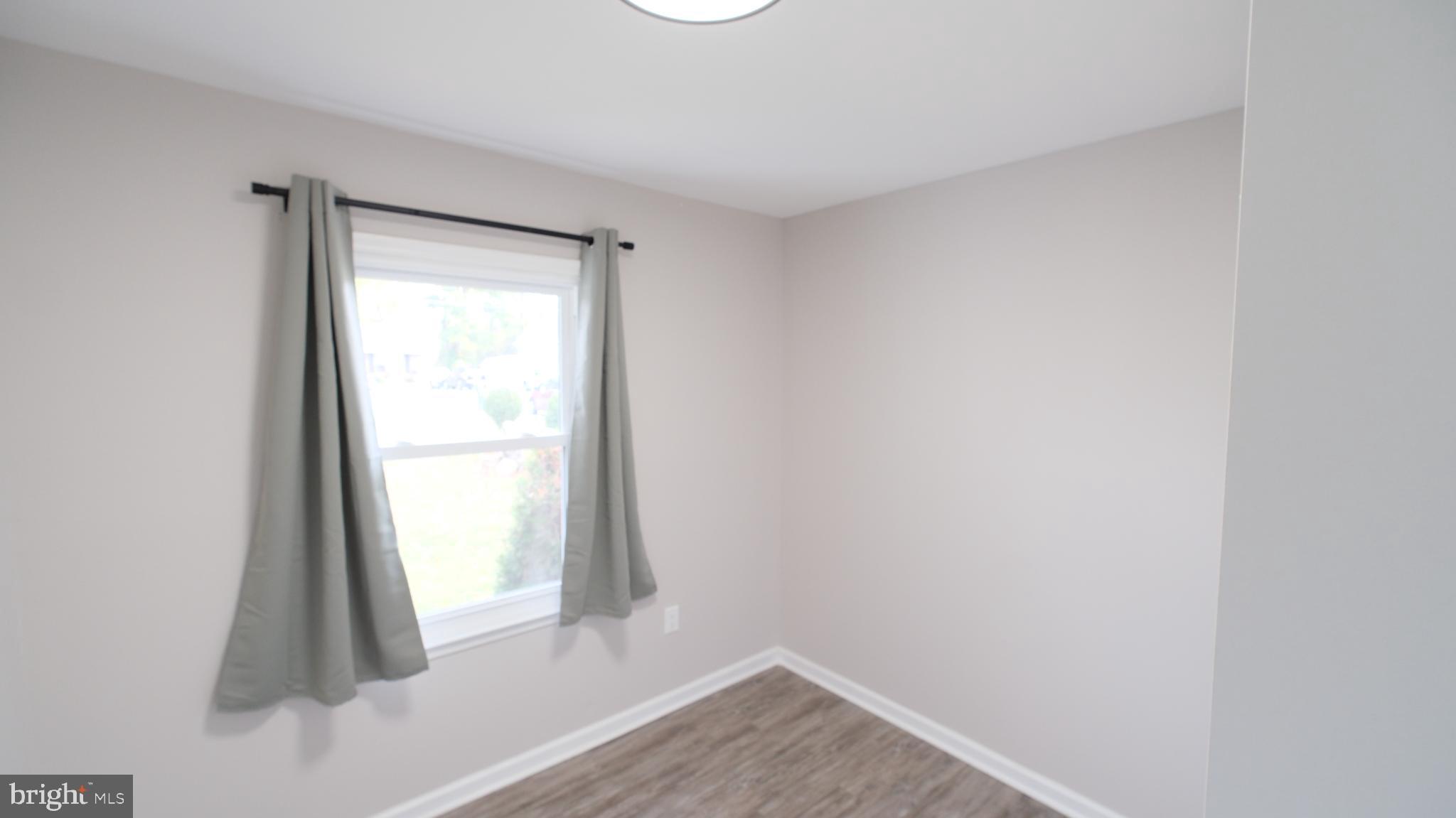 124 East Park Avenue Ranson, WV 25438 - Photo 12 of 23 a view of an empty room and window